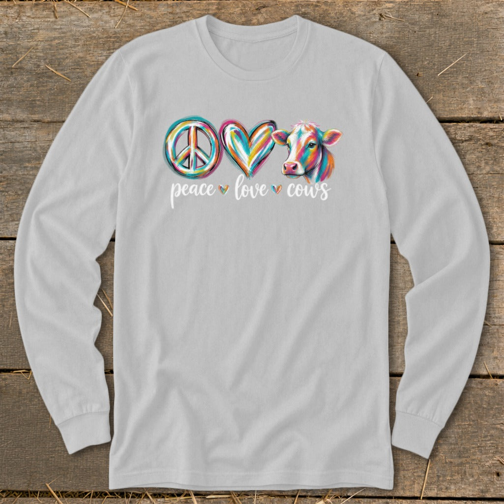 Long sleeve shirt with peace, heart, and cow graphic and text "peace love cows".