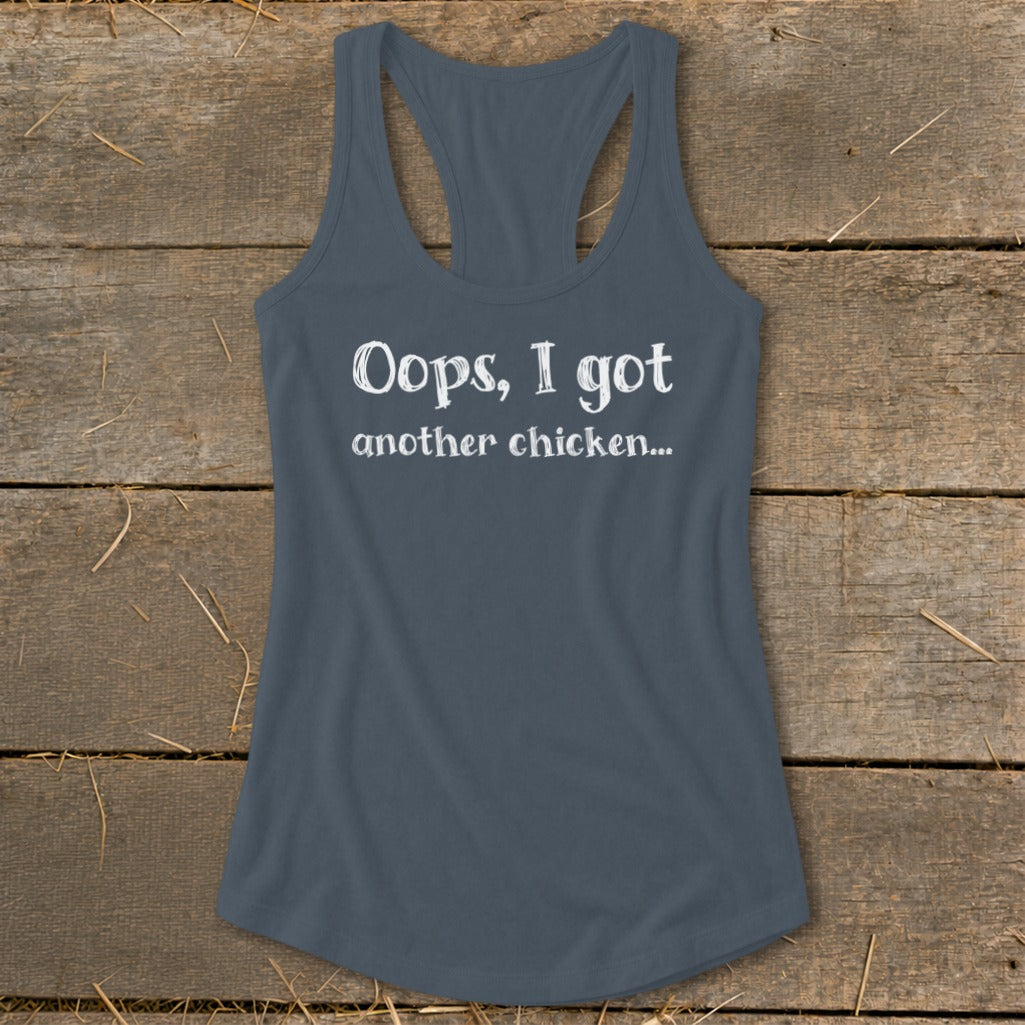 Grey racerback tank top with white text that reads "Oops, I got another chicken..."