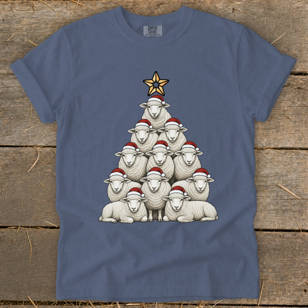 Sheep Christmas tree graphic with Santa hats and a star on a blue t-shirt.
