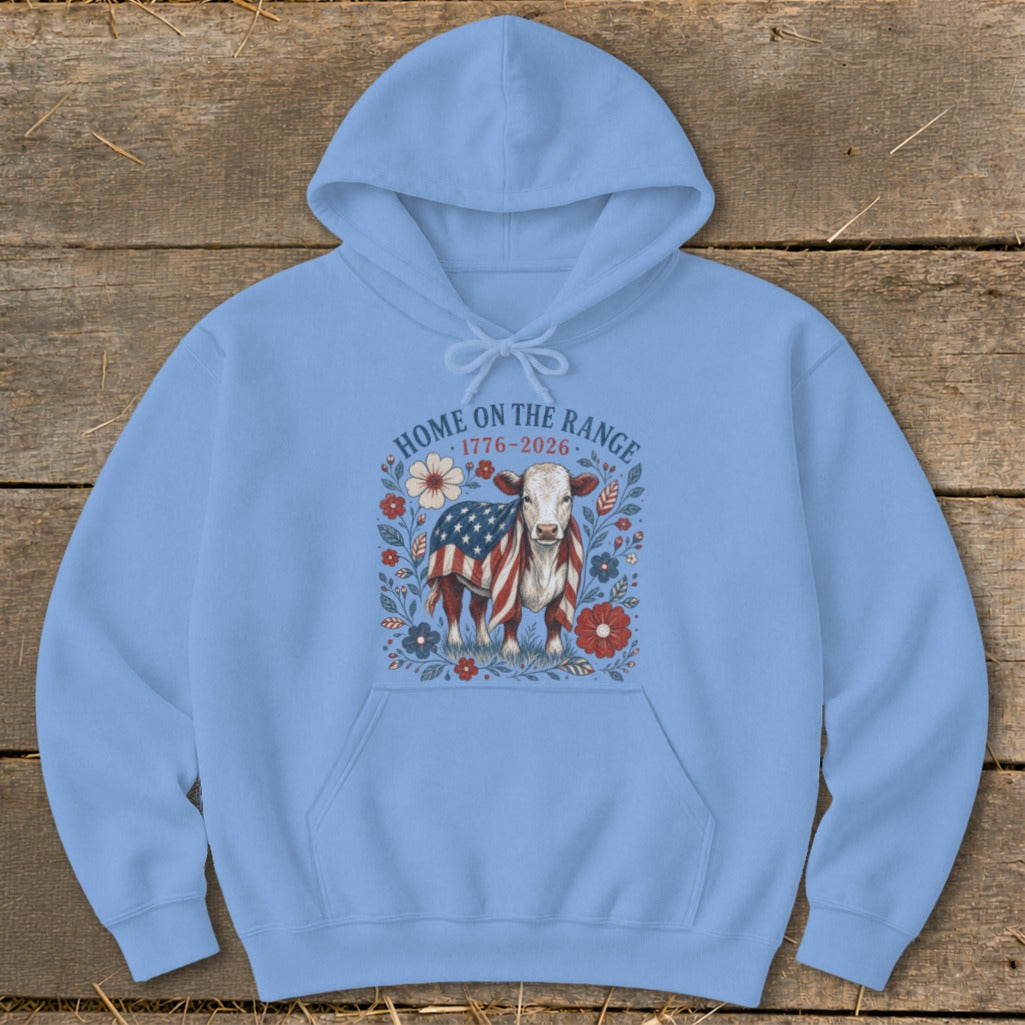 Light blue hoodie with a cow wearing a US flag, surrounded by flowers and text.