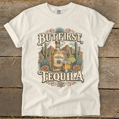 White t-shirt with "But First, Tequila" text and desert scene.