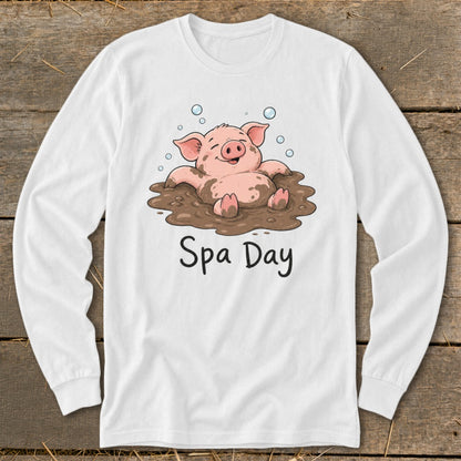 White long sleeve shirt with cartoon pig in mud and text "Spa Day".