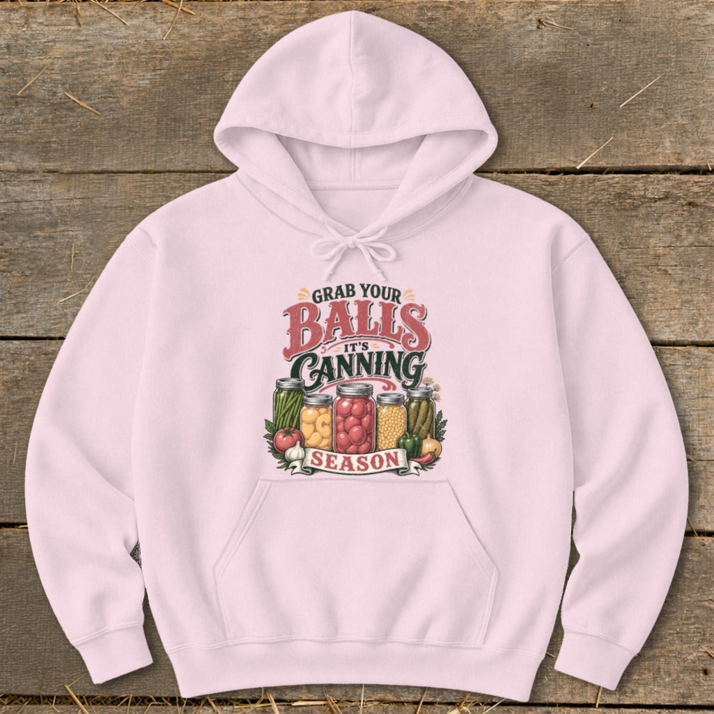 Pink hoodie with "Grab Your Balls It's Canning Season" graphic featuring mason jars of vegetables.
