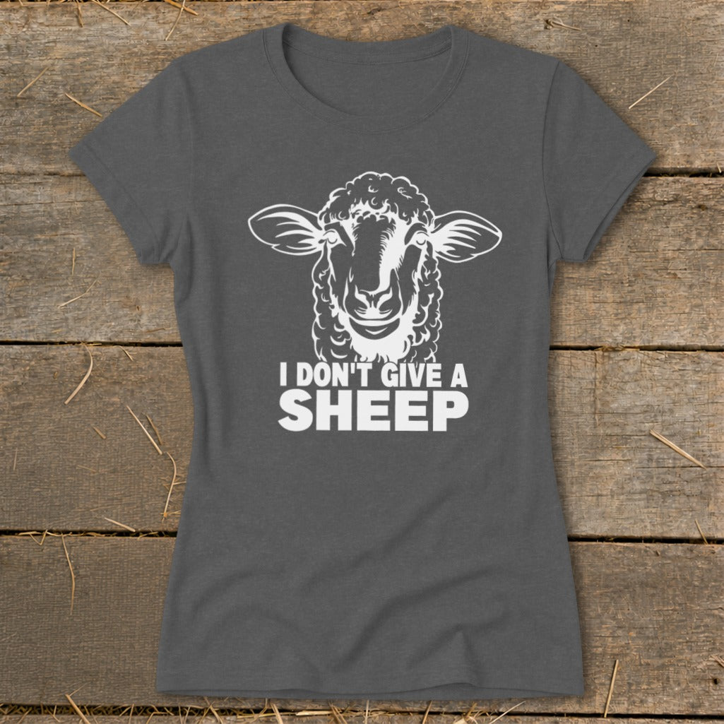 Dark gray t-shirt with white graphic of a sheep's head and text "I DON'T GIVE A SHEEP".