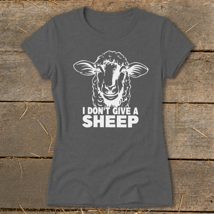 Dark gray t-shirt with white graphic of a sheep's head and text "I DON'T GIVE A SHEEP".