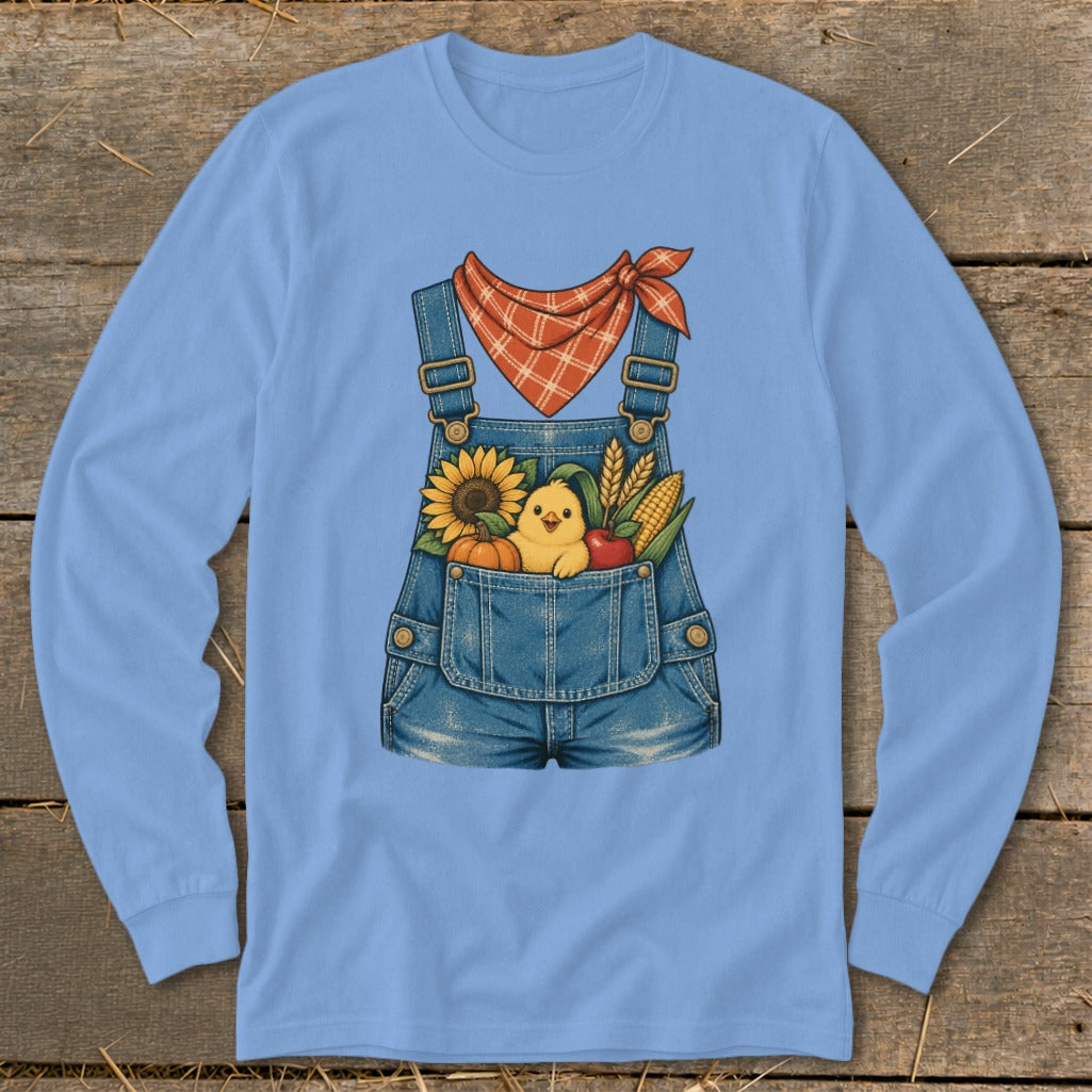 Denim overalls with a stuffed chick, sunflower, pumpkin, apple, and corn.