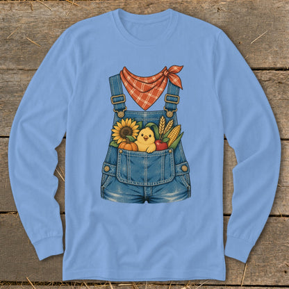 Denim overalls with a stuffed chick, sunflower, pumpkin, apple, and corn.
