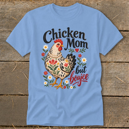 Chicken Mom but boujee text with a decorative chicken and flowers on a light blue t-shirt.