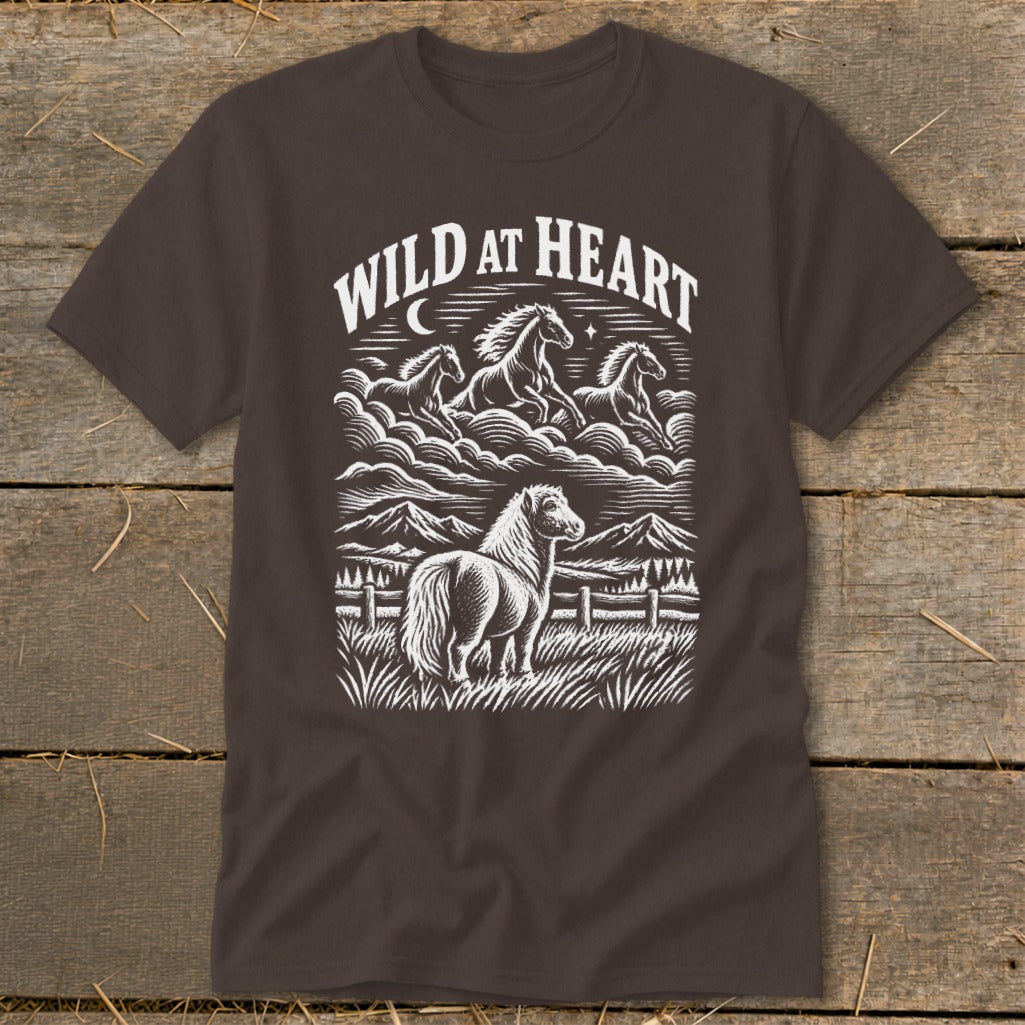 Brown t-shirt with white graphic of horses and mountains, text reads "WILD AT HEART".