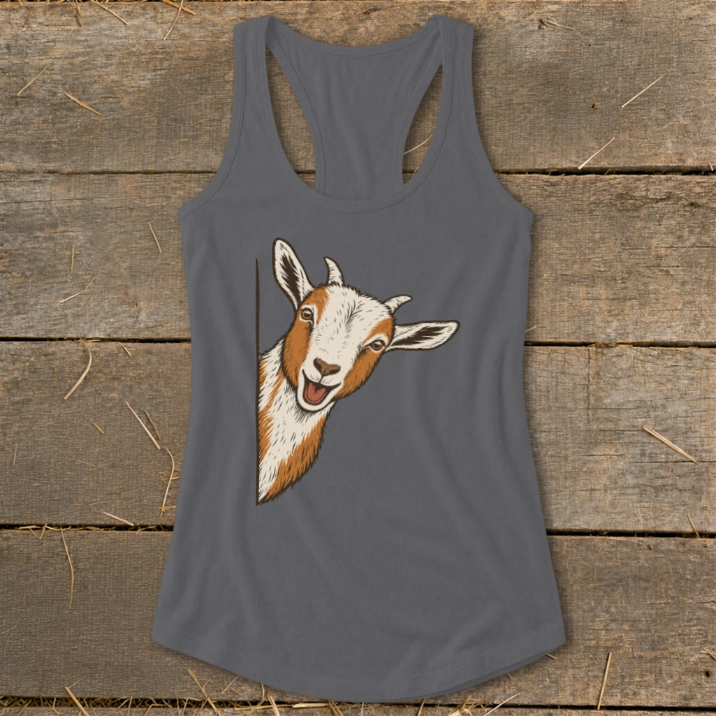 A playful goat peeks from the side of a grey tank top.
