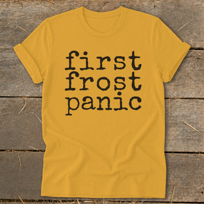 Mustard yellow t-shirt with black text "first frost panic" in a typewriter font.