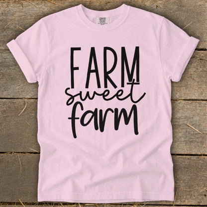 Pink t-shirt with black text reading "FARM sweet farm."