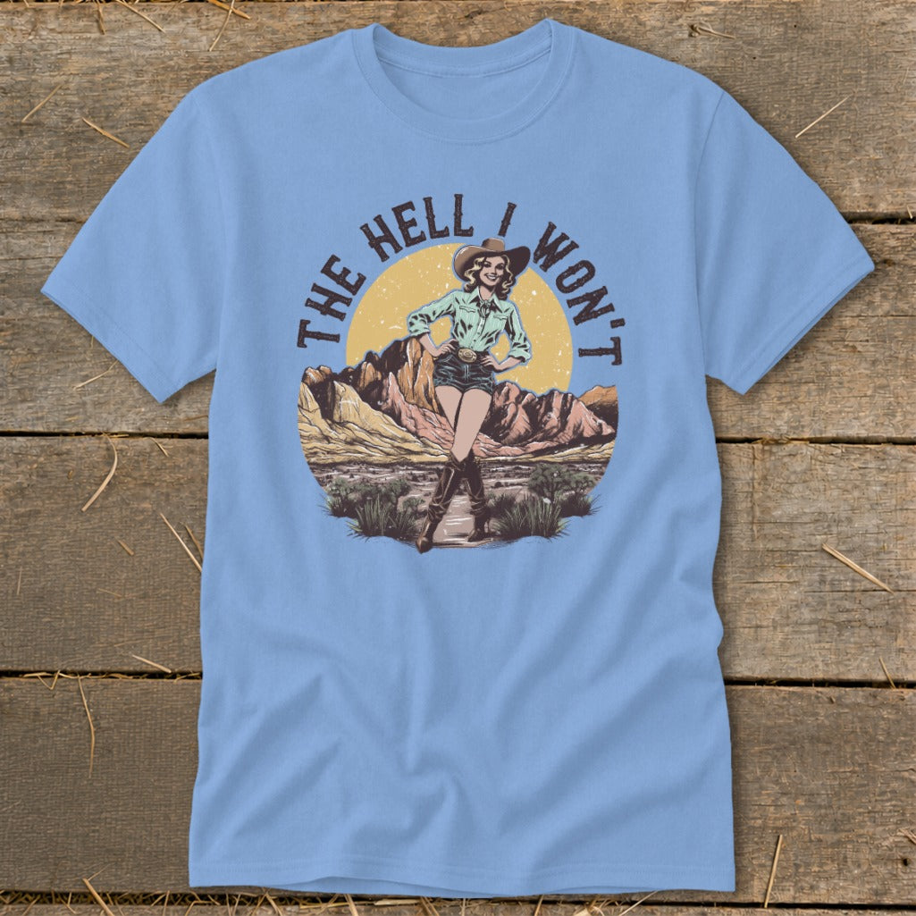Cowgirl graphic with text "THE HELL I WON'T" on a light blue t-shirt.
