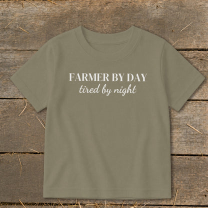 Olive green t-shirt with white text "FARMER BY DAY tired by night".