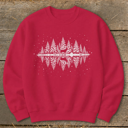 Red crewneck sweatshirt with a white forest and deer reflection graphic.