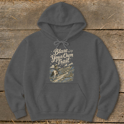 Dark gray hoodie with "Blaze Your Own Trail" text and cowboy on horseback graphic.