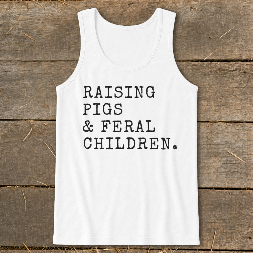 White tank top with "Raising Pigs & Feral Children" text in black typewriter font.
