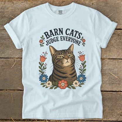 White t-shirt with a grumpy tabby cat and "Barn Cats Judge Everyone" text.