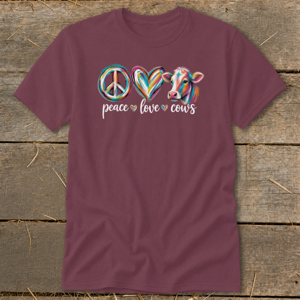 Maroon t-shirt with "Peace Love Cows" text and colorful peace, heart, and cow graphic.