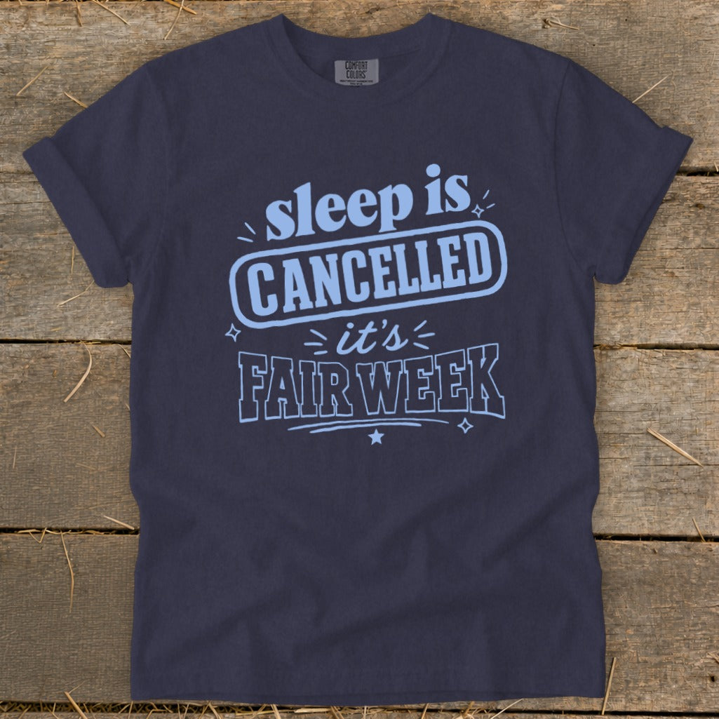 Navy t-shirt with "sleep is CANCELLED it's FAIR WEEK" in light blue text.