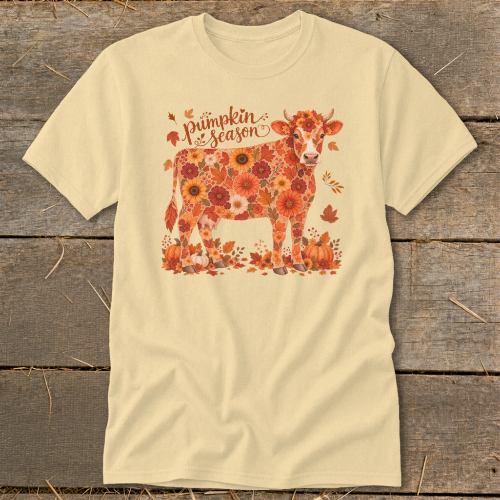 Cream t-shirt with a cow graphic made of autumn flowers and pumpkins, reading "Pumpkin Season."