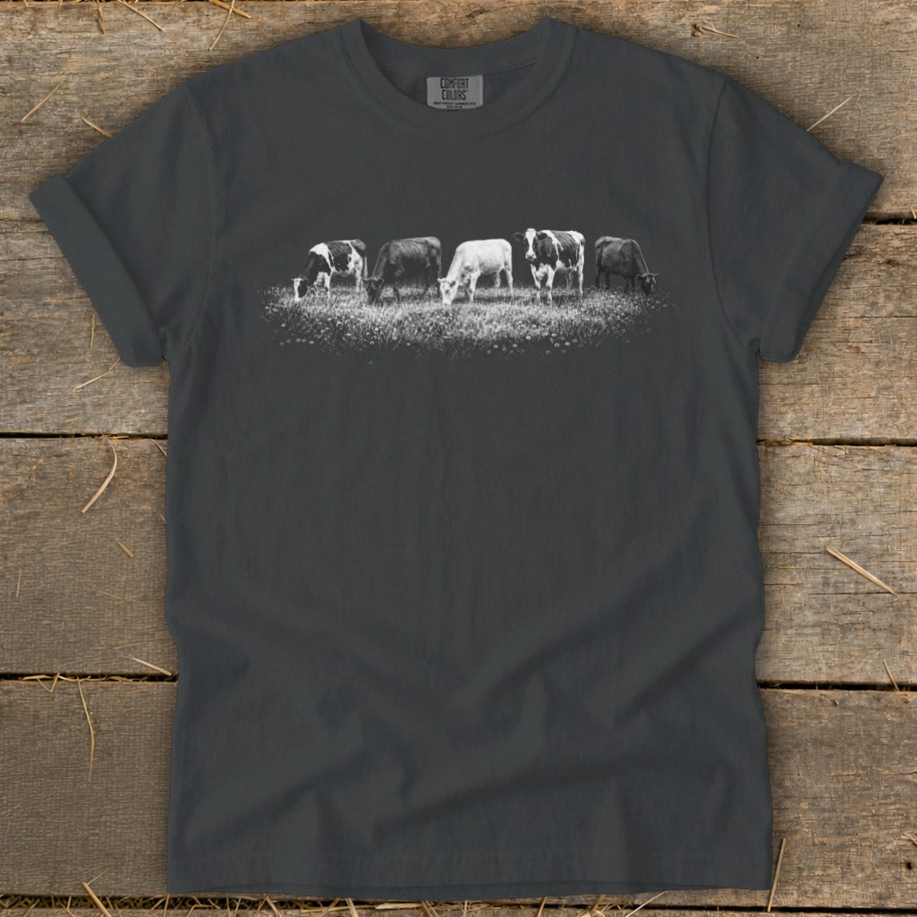 Dark gray t-shirt with five cows grazing in a field.