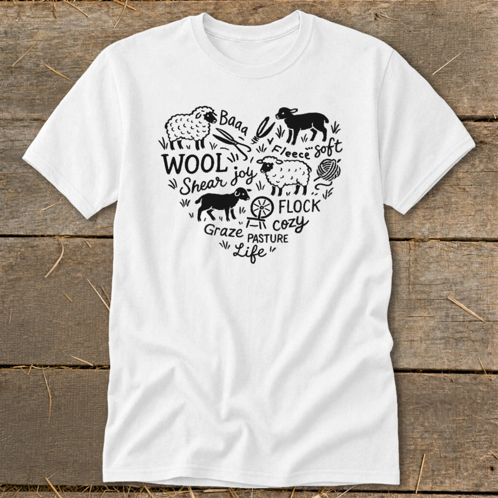White t-shirt with heart-shaped black sheep and wool-themed text design.