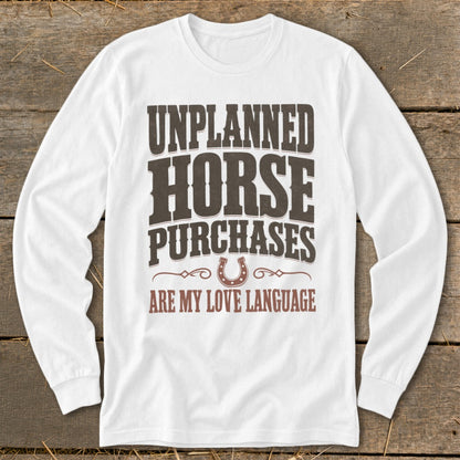 White long sleeve shirt with text "UNPLANNED HORSE PURCHASES ARE MY LOVE LANGUAGE".