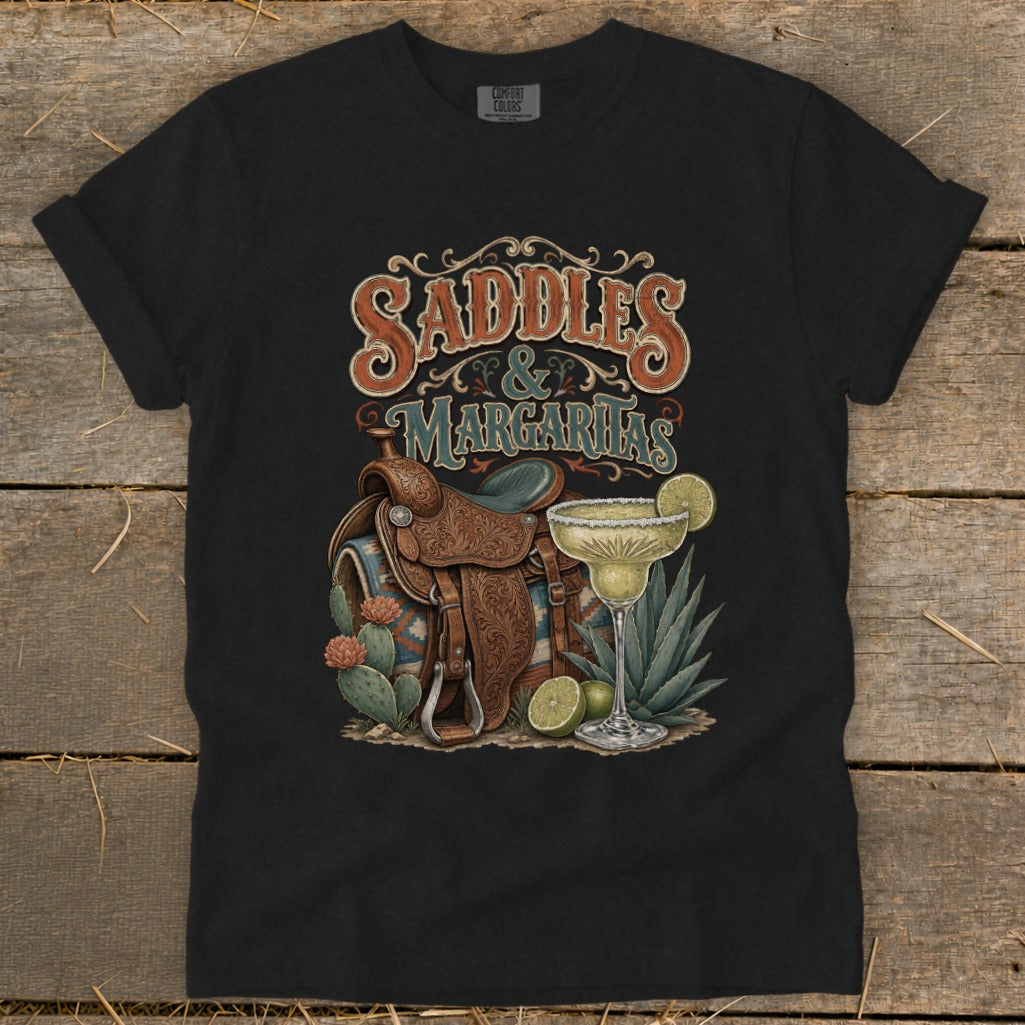 Black t-shirt graphic with "Saddles & Margaritas" text, western saddle, margarita glass, and cacti.