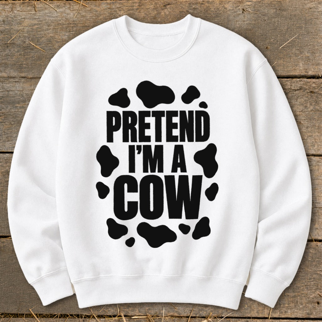 White crewneck sweatshirt with "PRETEND I'M A COW" in black text and cow spots.
