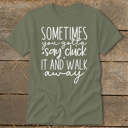 Olive green t-shirt with white text: "Sometimes you gotta say cluck it and walk away."