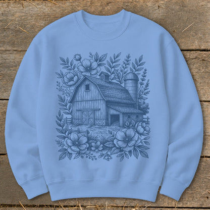 Light blue sweatshirt with a dark blue graphic of a barn, silo, and floral border.