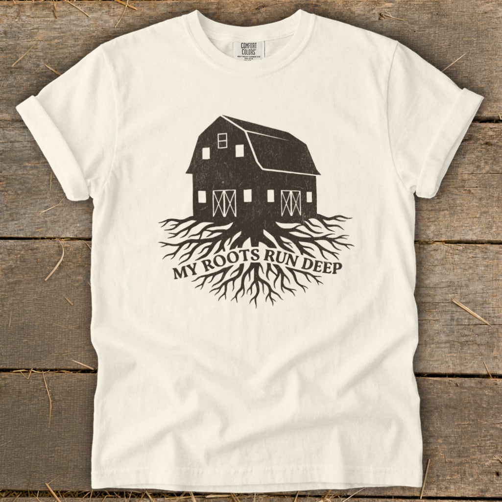 Barn with roots graphic and text "MY ROOTS RUN DEEP" on a white t-shirt.