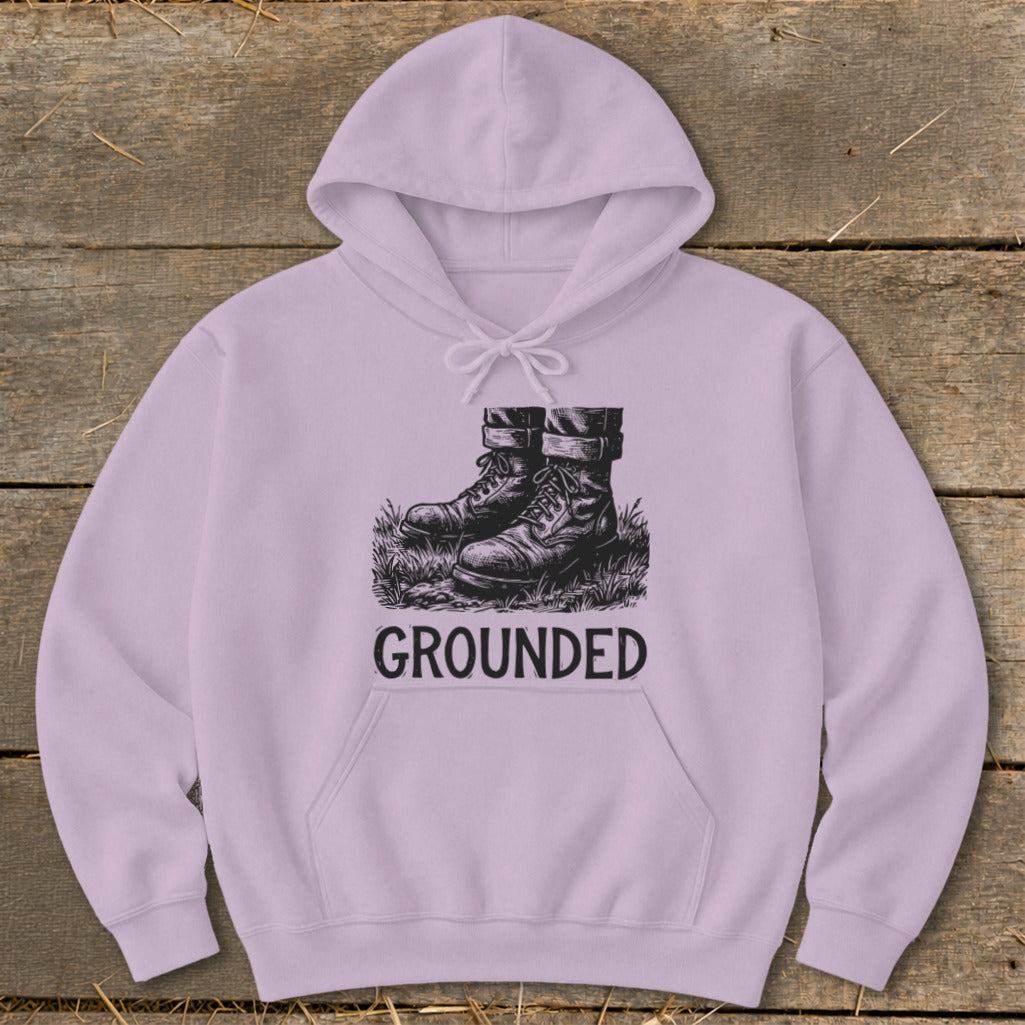 Light purple hoodie with sketch of boots on grass and the word GROUNDED.