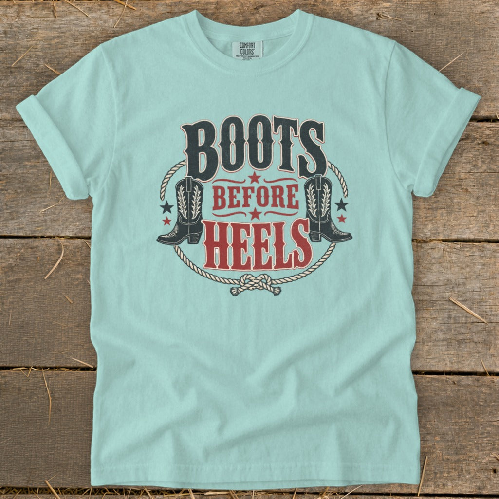 Light blue t-shirt with "Boots Before Heels" text and cowboy boots graphic.