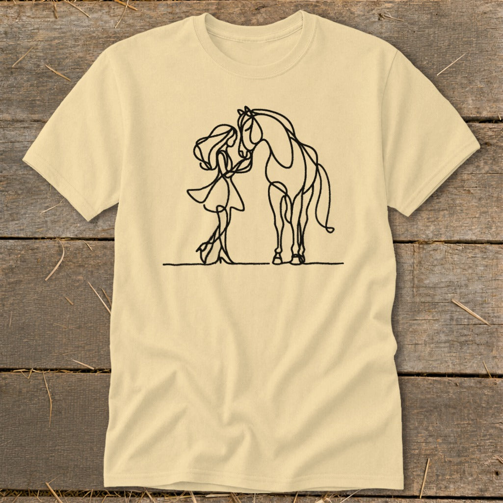 Minimalist line art of a girl and horse on a pale yellow t-shirt.