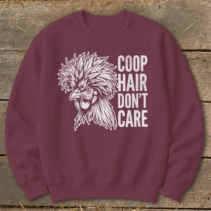 Maroon sweatshirt with white graphic of a crested chicken and text "COOP HAIR DON'T CARE".