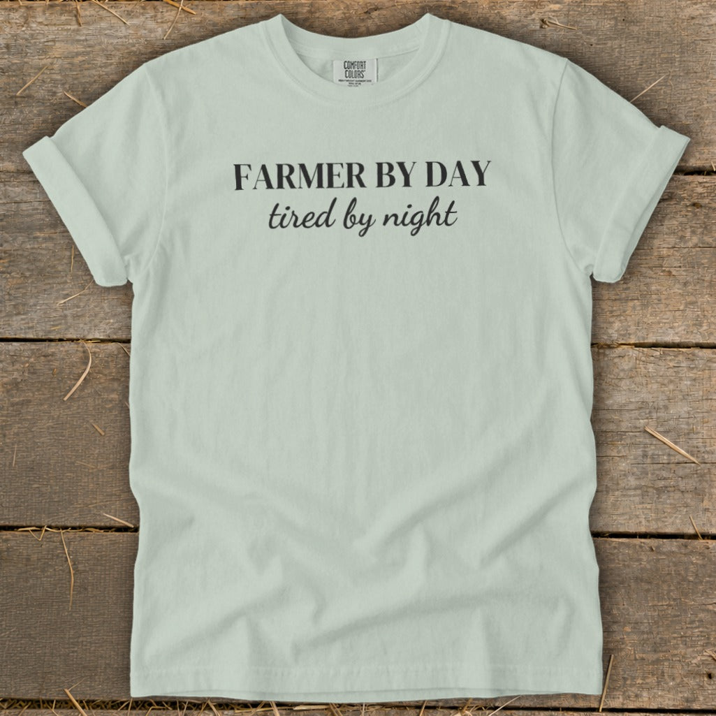 Light blue t-shirt with "FARMER BY DAY tired by night" printed on the front.