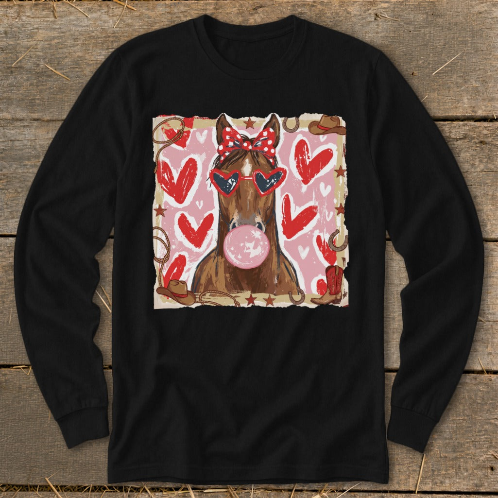 Horse with bandana and heart sunglasses blows bubblegum, surrounded by hearts and western motifs.