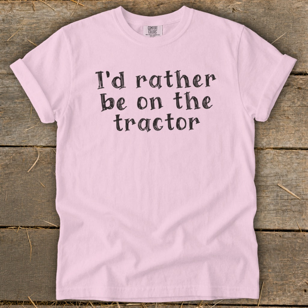 Pink t-shirt with "I'd rather be on the tractor" text.