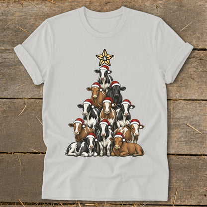 Christmas tree shaped arrangement of cows wearing Santa hats, topped with a star.
