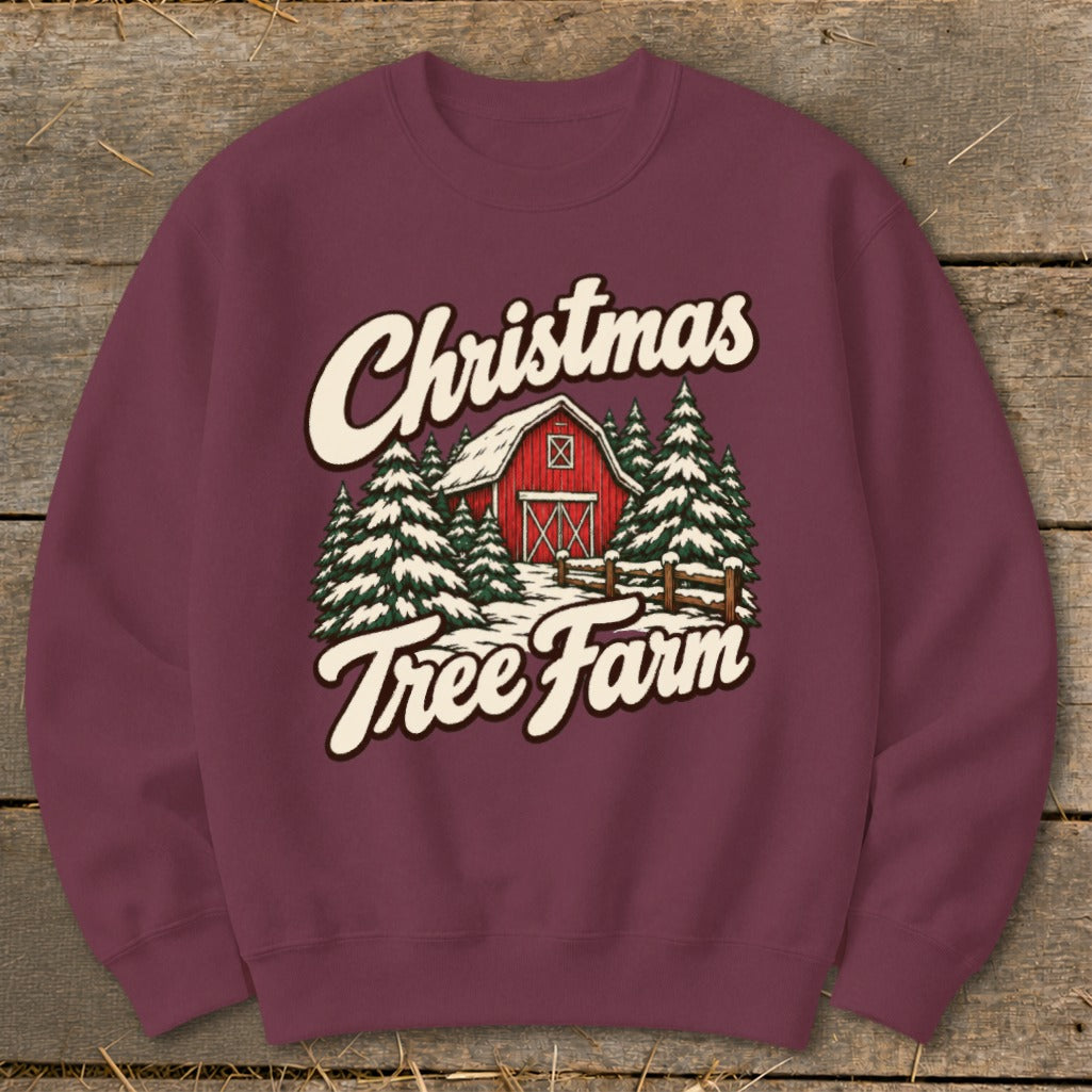 Maroon sweatshirt with "Christmas Tree Farm" text and a red barn with snow-covered trees.