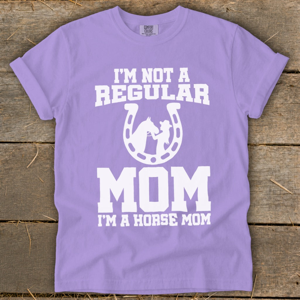Purple t-shirt with white text and graphics: "I'M NOT A REGULAR MOM I'M A HORSE MOM".
