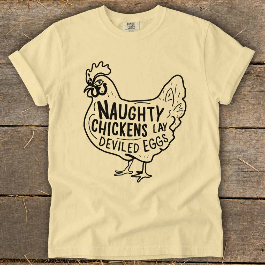 Yellow t-shirt with black graphic of a chicken saying "Naughty Chickens Lay Deviled Eggs".