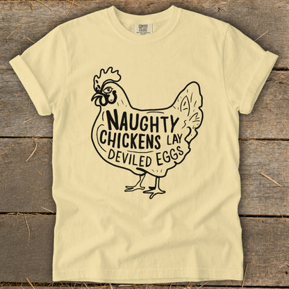 Yellow t-shirt with black graphic of a chicken saying "Naughty Chickens Lay Deviled Eggs".