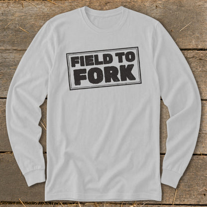 A light gray long-sleeve t-shirt with a distressed black box graphic reading "FIELD TO FORK" centered on the chest.