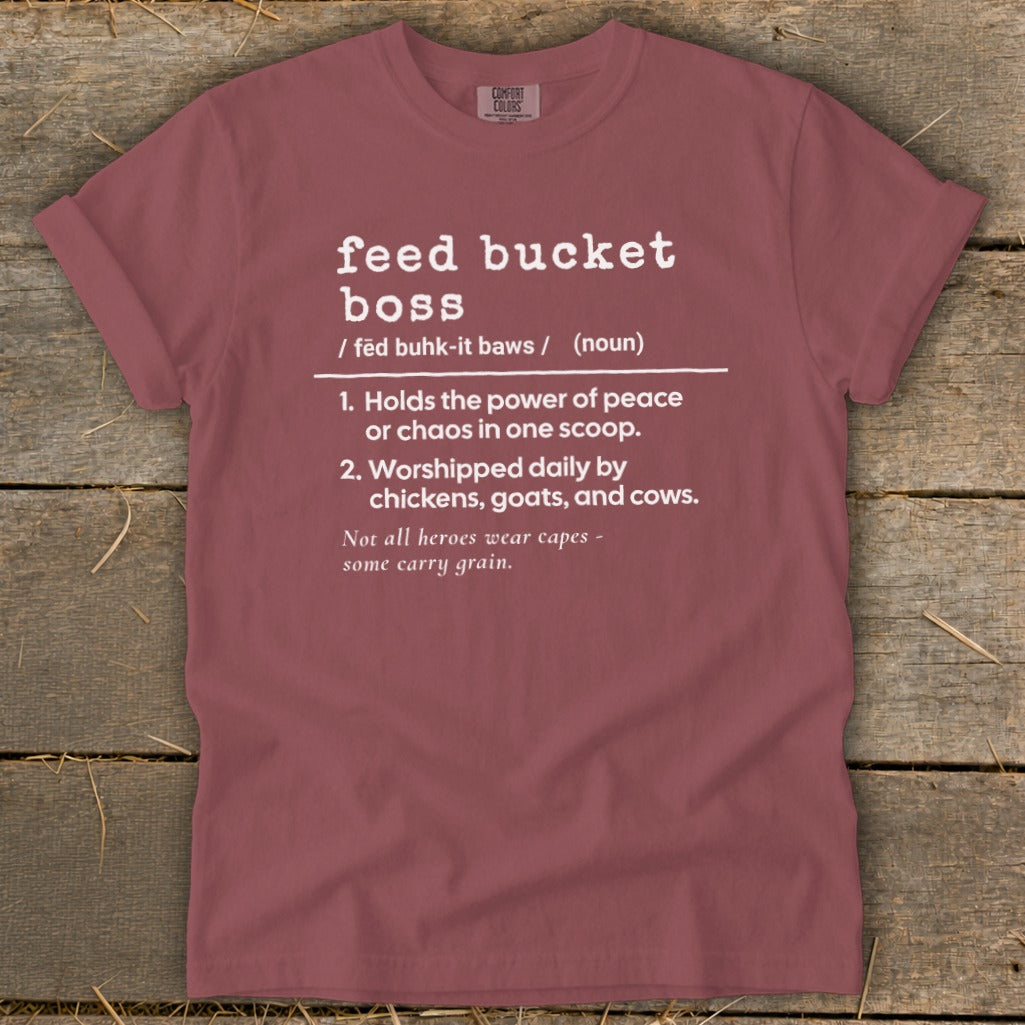 Maroon t-shirt with white text defining "feed bucket boss" and a funny quote.