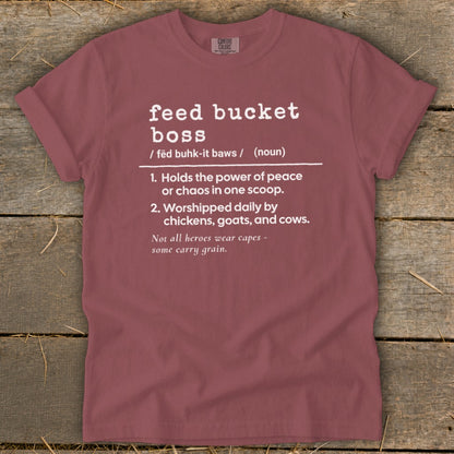 Maroon t-shirt with white text defining "feed bucket boss" and a funny quote.