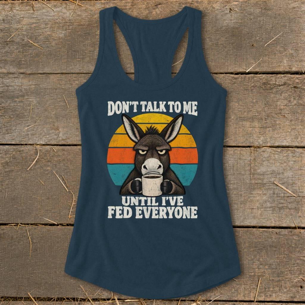 Dark blue racerback tank top with a retro graphic of a grumpy donkey drinking coffee.