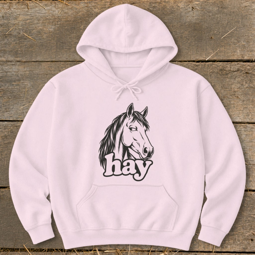 Pink hoodie with a black horse head illustration and the word "hay".